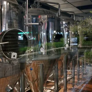 a row of stainless steel tanks