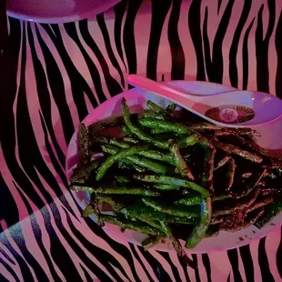 a plate of asparagus and other vegetables