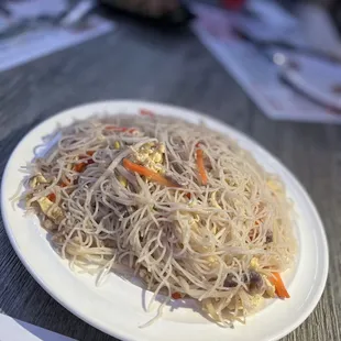 a plate of noodles on a table
