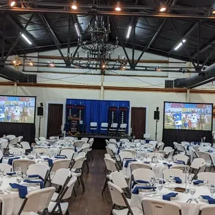 Dual screen video projection for school. A/V and lighting.