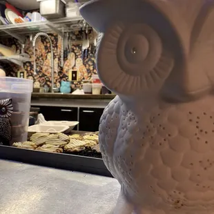 Part of the storefront window with cookies cooling in the window