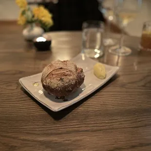 a loaf of bread on a plate on a table