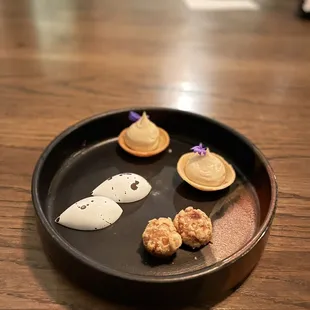 a plate of desserts on a table