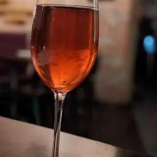 a glass of wine on a table