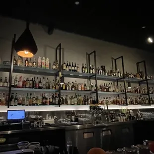a bar filled with bottles of alcohol