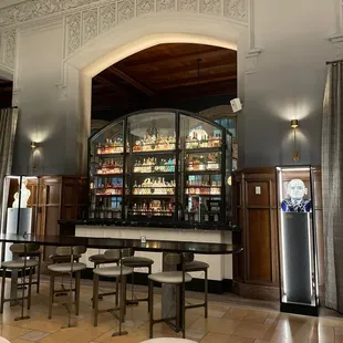 a bar with tables and chairs