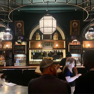 a group of people sitting at a bar