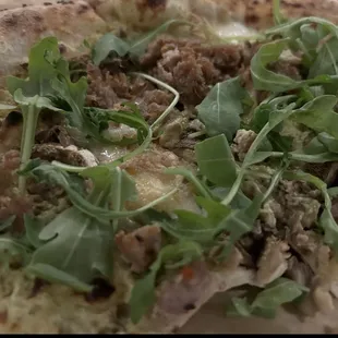 Salsiccia Pizza with added mushrooms and arugula