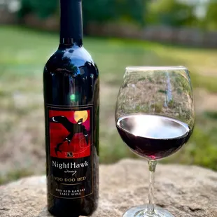 a glass of wine and a cork