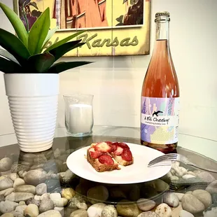 a plate of food and a bottle of wine