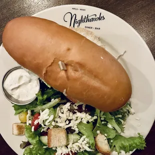Beer battered walleye sandwich on a huge hoagie bun and side salad
