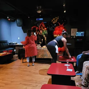 a woman bending over a table