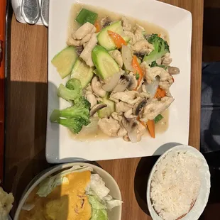 a plate of chicken and vegetables
