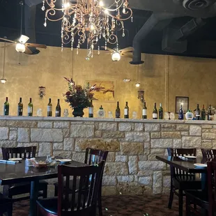 a chandelier and wine bottles