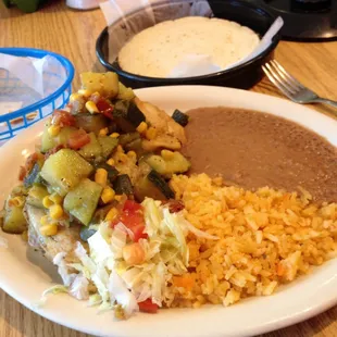 Calabacitas con pollo. Good food. Awful service. Hateful waitress