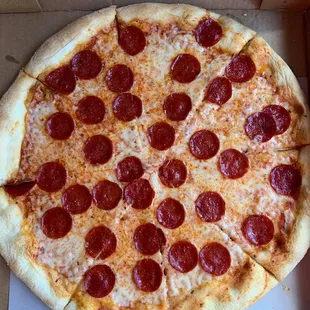 a pepperoni pizza in a box