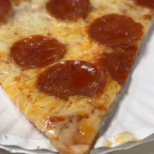 a slice of pepperoni pizza