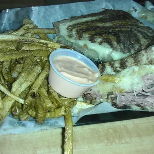 The grilled Reuben on marbled rye, with fries. 1000 Island dressing on the side.  It is gigantic and it is delicious!