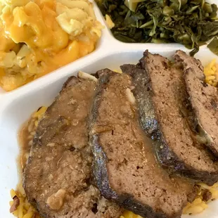 Meatloaf with mac and cheese, collard greens, and yellow rice