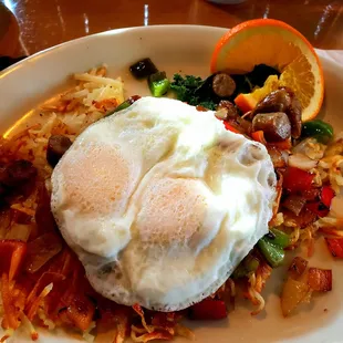 Country Grill: Hash browns sautéed with onions, green and red peppers, topped with cheddar cheese, sausage &amp; 2 eggs.