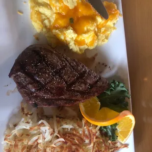 Eggs with cheese, steak med and hash browns