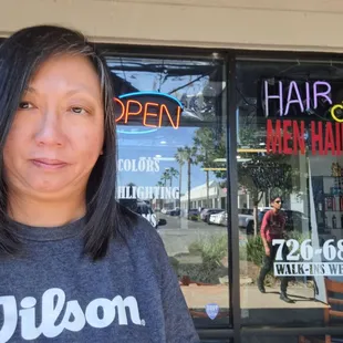 My 5/9/24 haircut by Amy outside Nikki's Salon - My hair is so wavy these days that she had to flat iron my hair in order to cut straight.