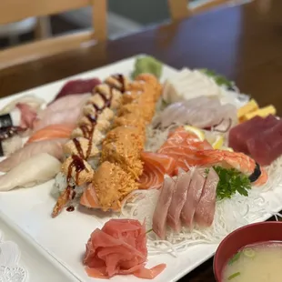 a plate of sushi and a bowl of soup