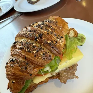 Sausage, egg, and cheese on a croissant seasoned with everything bagel seasoning