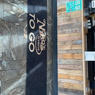 ows a sign on the side of a building