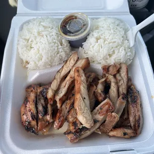 Dry chicken with a tiny teriyaki container and two scoops of dry (not sticky) rice. $16