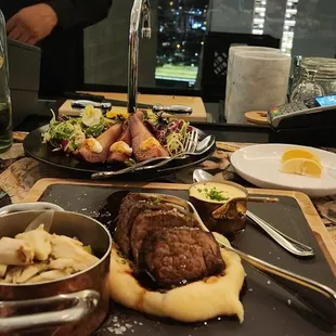 a table of food and wine glasses