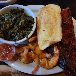 Greens, fried shrimp and rib dinner with super thick piece of toasted bread