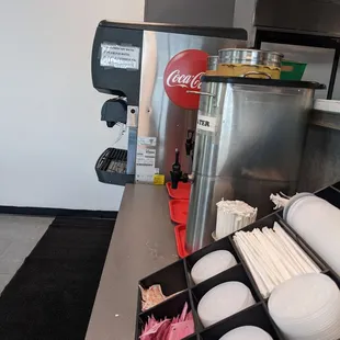 a counter with a soda dispenser