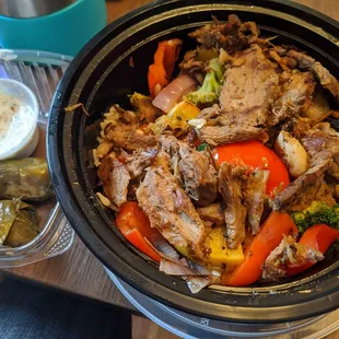 Roasted lamb bowl and dolmades with tzatziki