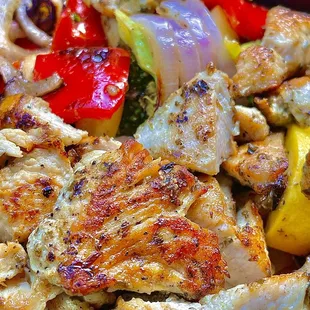 a plate of chicken and vegetables