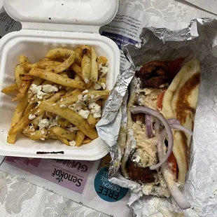 Fries and falafel gyro. Falafel was crunchy as I hoped, don&apos;t forget to grab sauces on your way out