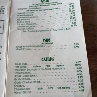 a hand holding a menu