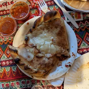 a slice of pizza on a plate