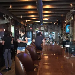 a bar with leather chairs