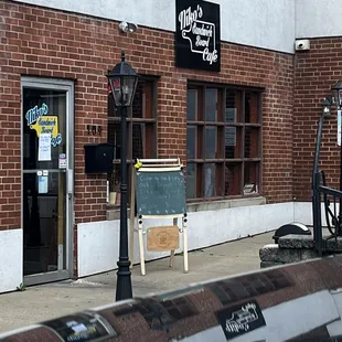 Outside. There is a small patio with tables