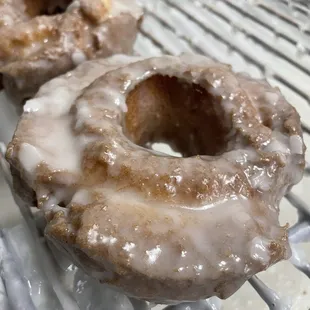 Glaze over a hot sour cream cake donut.