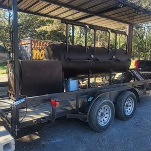 a trailer with a bbq on it