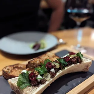 Bone Marrow, excellent toppings cut the richness of the marrow.