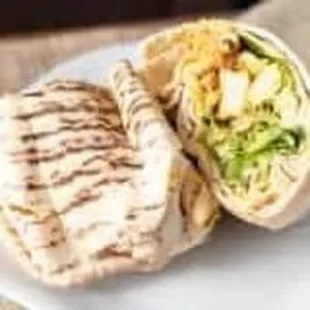 Chicken Shawarma Sandwich
Thin slices of spiced grilled chicken with tomato, pickles, parsley