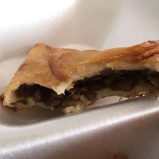 Meager layer of lentils inside what looks to be a flour tortilla being sold as a sambusa.