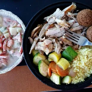 (L-R) Jerusalem salad, chicken shawarma, veggies, falafel, Middle Eastern rice