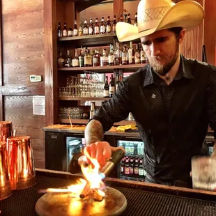 a bartender making a drink