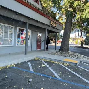 a man standing in front of a store