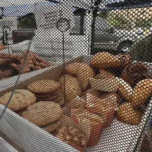 a conveyor belt full of donuts