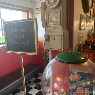 A gumball machine and a rotary dial pay phone? Smiles